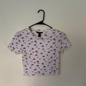 Hi! Today I am selling a little crop tee that has cute little roses on them:)